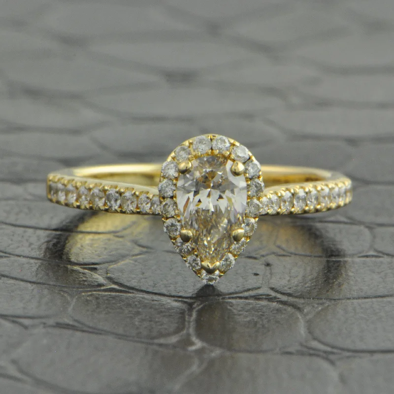 Must-Have Jewelry At Irresistible Discounts .50 ct. Pear Shape Diamond Halo Engagement Ring in Yellow Gold